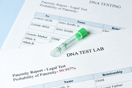 paternity test results report with lab sample test tube.